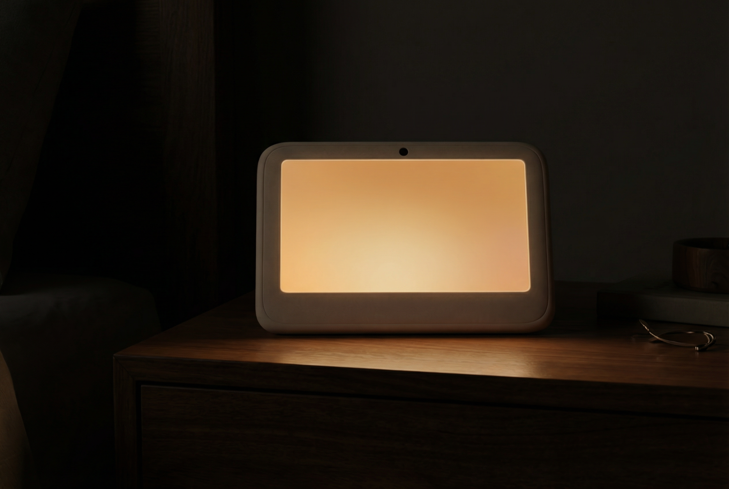 Ægis in sleep mode — warm amber glow on nightstand